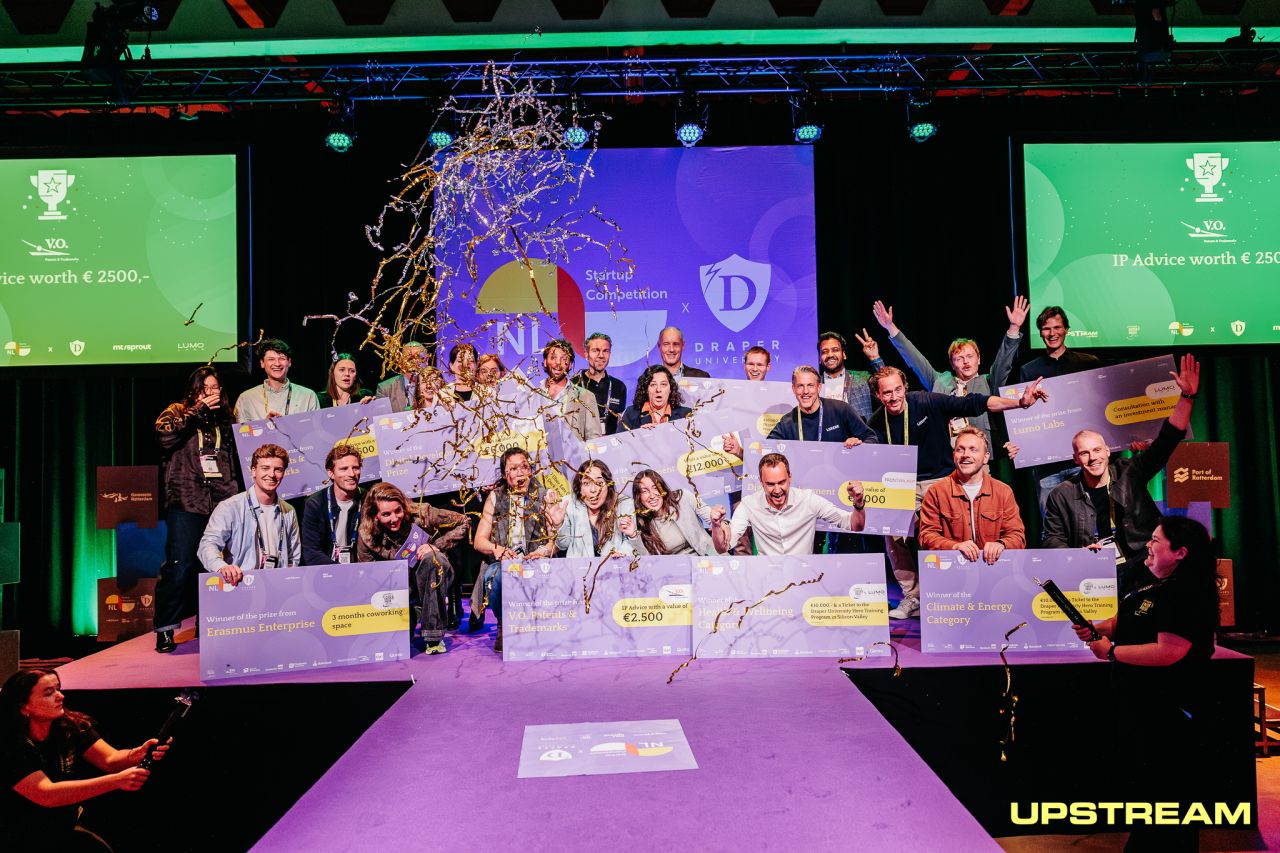 Winners celebrating on stage at the NL Startup Competition finale, including the Lumox team